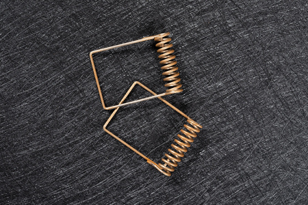 top view two pieces rusty springs on dark background