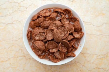 top view chocolate milk with cereal slices as healthy eatingの写真素材