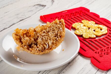 cut out  traditional Chinese fried sesame ball with a label on back English translation of Chinese-luckの写真素材