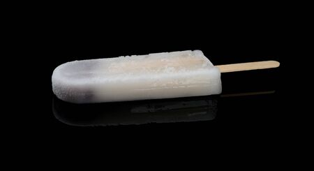 ice cream stick with red bean inside on black backgroundの写真素材