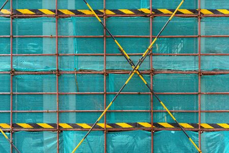 scaffolding and protection netting on an unfinished building