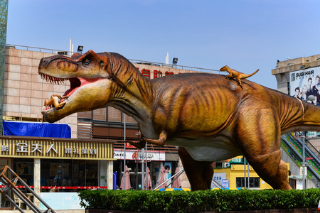ZhongShan China-July 17,2019:giant size tyrannosaurus outside a shopping mall.のeditorial素材