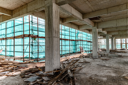 inside of an unfinshed building with protection scaffolding and netting surroundedのeditorial素材