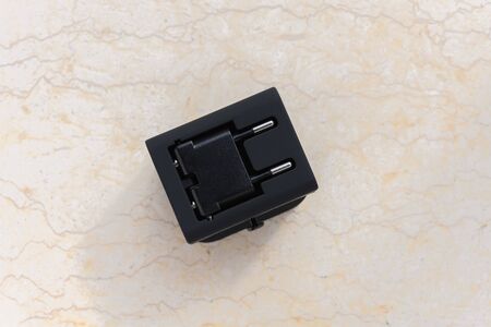 top view a brand new black universal adapter
