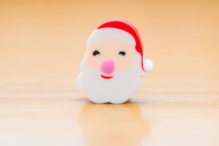 christmas decorative doll of santa claus on wood backgroundの写真素材