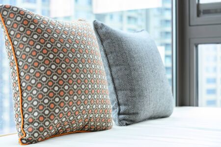 resting area of a cozy window seat with cushion in the morning horizontal compositionの写真素材