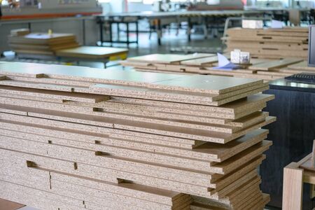 MDF boards stacked up inside the factory workshop
