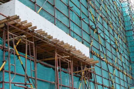 scaffolding and protection netting on an unfinished building