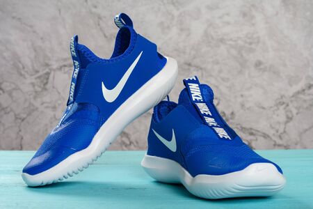 Zhongshan,China-November 19, 2019:pair of nike blue sporty shoes for kid.のeditorial素材