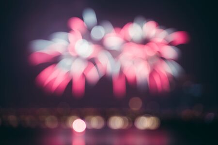 fireworks show in a modern city at blurred focus as background horizontal composition