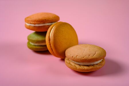 multi-color macaroon on a pink background