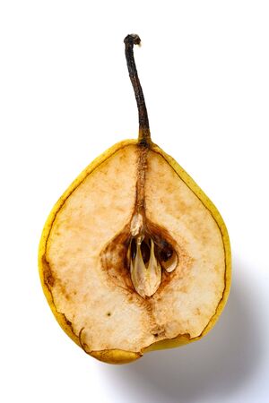 cut out section of an overripe pear on white backgroundの写真素材