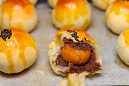 fresh homemade traditional chinese snack of preserved egg cakes with one piece cut out close upの写真素材