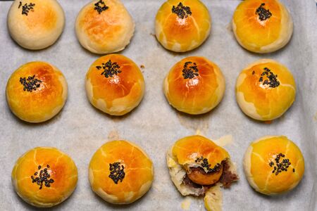 top view fresh homemade traditional chinese snack of preserved egg cakes with one piece cut out