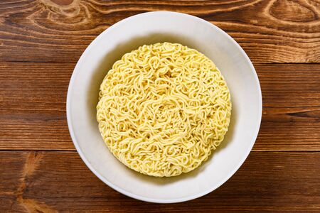 top view raw instant noodles in a bowlの写真素材