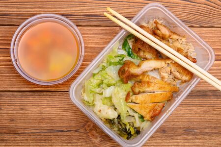 top view fast food of deep fried chicken with rice and cabbage and soupの写真素材
