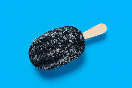 chocolate flavor ice cream stick with shredded coconut on the outside