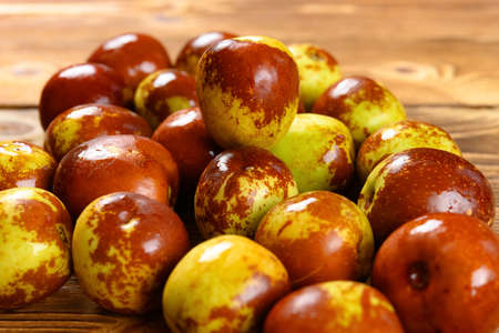 fresh winter jujube on a wood backgroundの写真素材