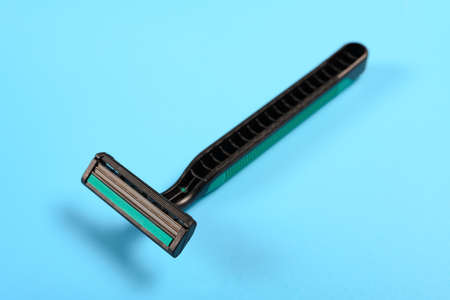disposable shaver on a blue background