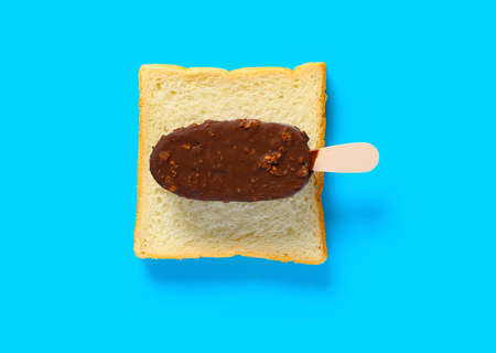 fresh chocolate with peanut flavor ice cream stick on slice of bread