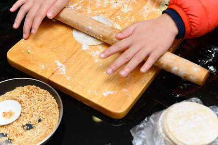 kid making cakes at home