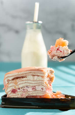 healthy breakfast of cherry flavor cake and bottle of milk