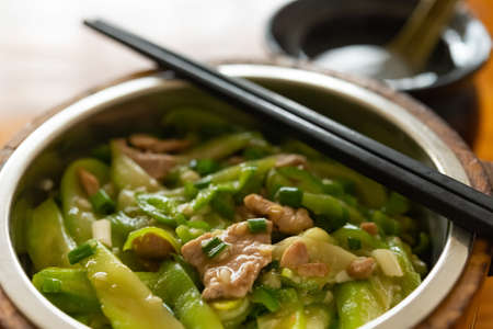 side view fast food of pork and towel gourd with rice and soupの写真素材