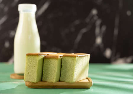 matcha flavor cakes and bottle milk as a healthy breakfast horizontal compositionの写真素材