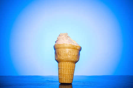 half eaten ice cup with blue backlitの写真素材