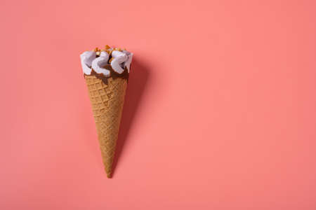 top view sweet potato flavor ice cream cone on a pink background