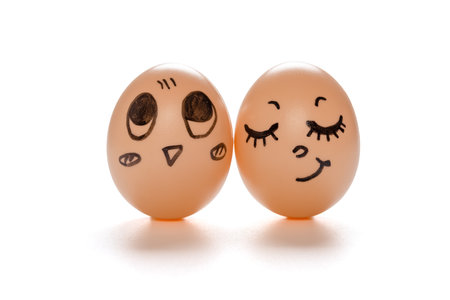egg faces of lovely couple on white