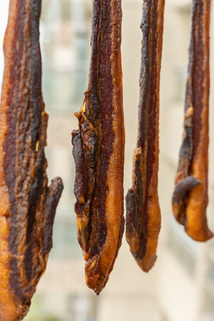 making air-dried bacon in a balcony vertical compositionの写真素材