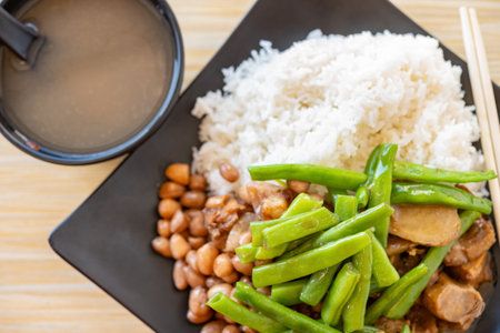 top view fast food duck meat with pork and peanuts and beans with rice and porridge horizontal compositionの写真素材