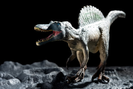 spinosaurus on a ground with cratersの写真素材