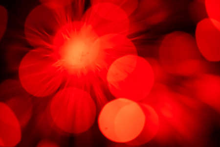 defocused red optical fibre as a flare backgroundの写真素材