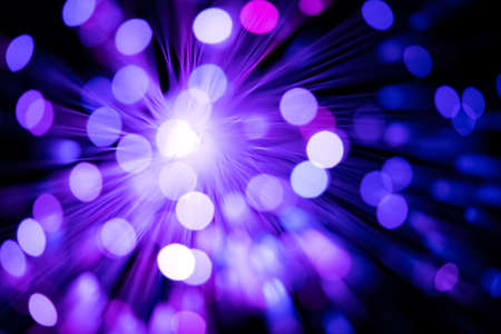 defocused purple optical fibre as a flare backgroundの写真素材