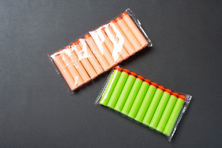 soft toy bullets for children on dark background