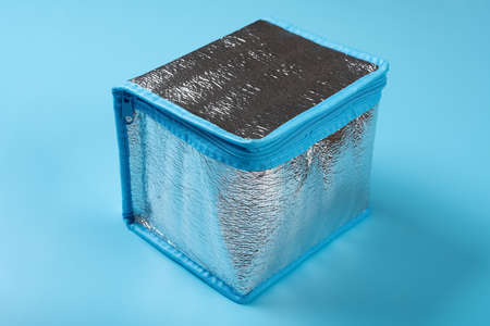 a small insulation bag on blue backgroundの写真素材
