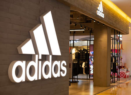ZHONGSHAN GUANGDONG China-March 30 2021:adidas logo and the shop in a shopping mall.