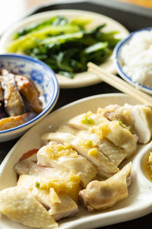 angle view fast food of steamed chicken with eggplant and vegetable and bowl of rice vertical compositionの写真素材
