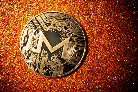 Monero coin on a dark background close up