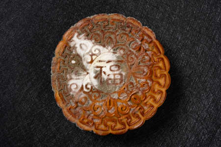 English translation of the Chinese-fortune-top view badly moldy moon cake