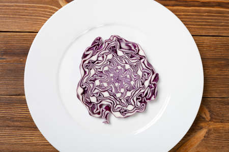 top view cross section of a purple cabbage on a dishの写真素材