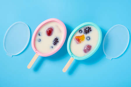 DIY ice pop made with strawberry and blue berry and mango