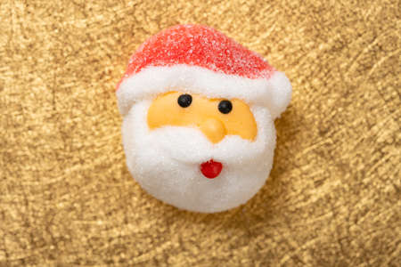 Santa Claus candy on gold backgroundの写真素材