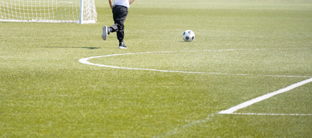 a boy playing soccer on the field