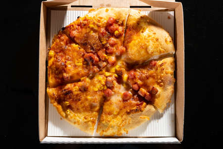top view fresh pizza with sausages in a box