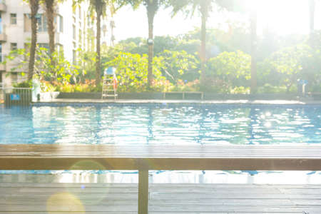 swimming pool in a morning with a rising sun at horizontal composition