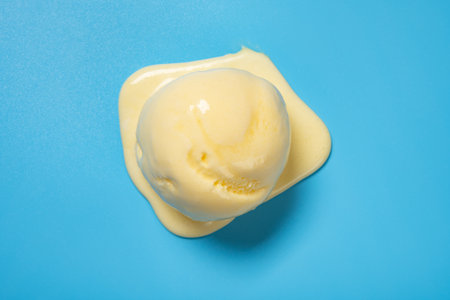 top view pineapple flavor ice cream ball on blue backgroundの写真素材