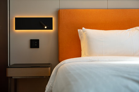 bed in a hotel room horizontal compositionの写真素材